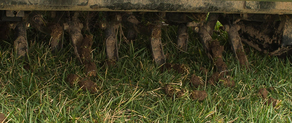 Aerator machine servicing a lawn in Delaware, OH.